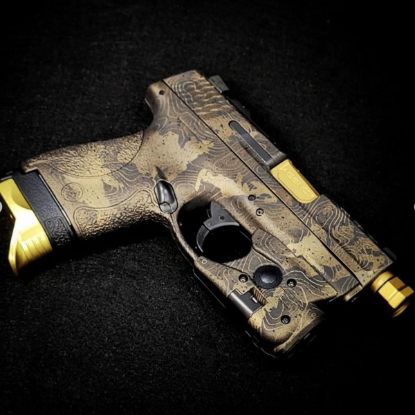 Custom Cerkote and Lasering on a  M & P
